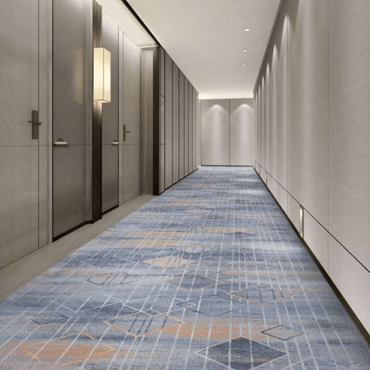 Luxury hotel corridor with Wilton carpet in blue, gray, and copper geometric patterns