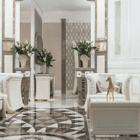 Elegant living room with symmetrical marble-style carpet pattern in grayscale tones