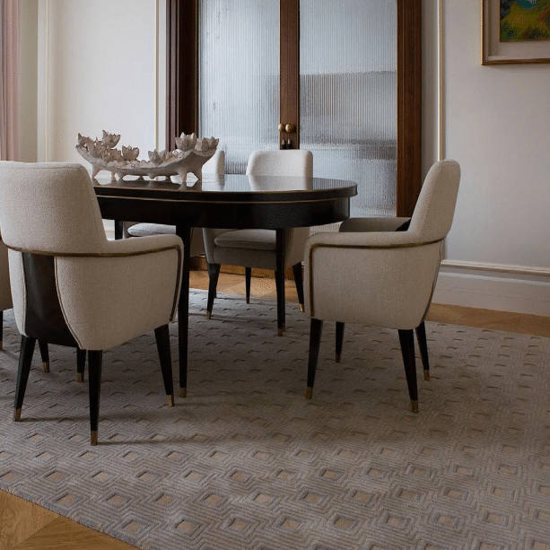 Modern dining room with taupe hand tufted carpet in 3D cube-like geometric pattern