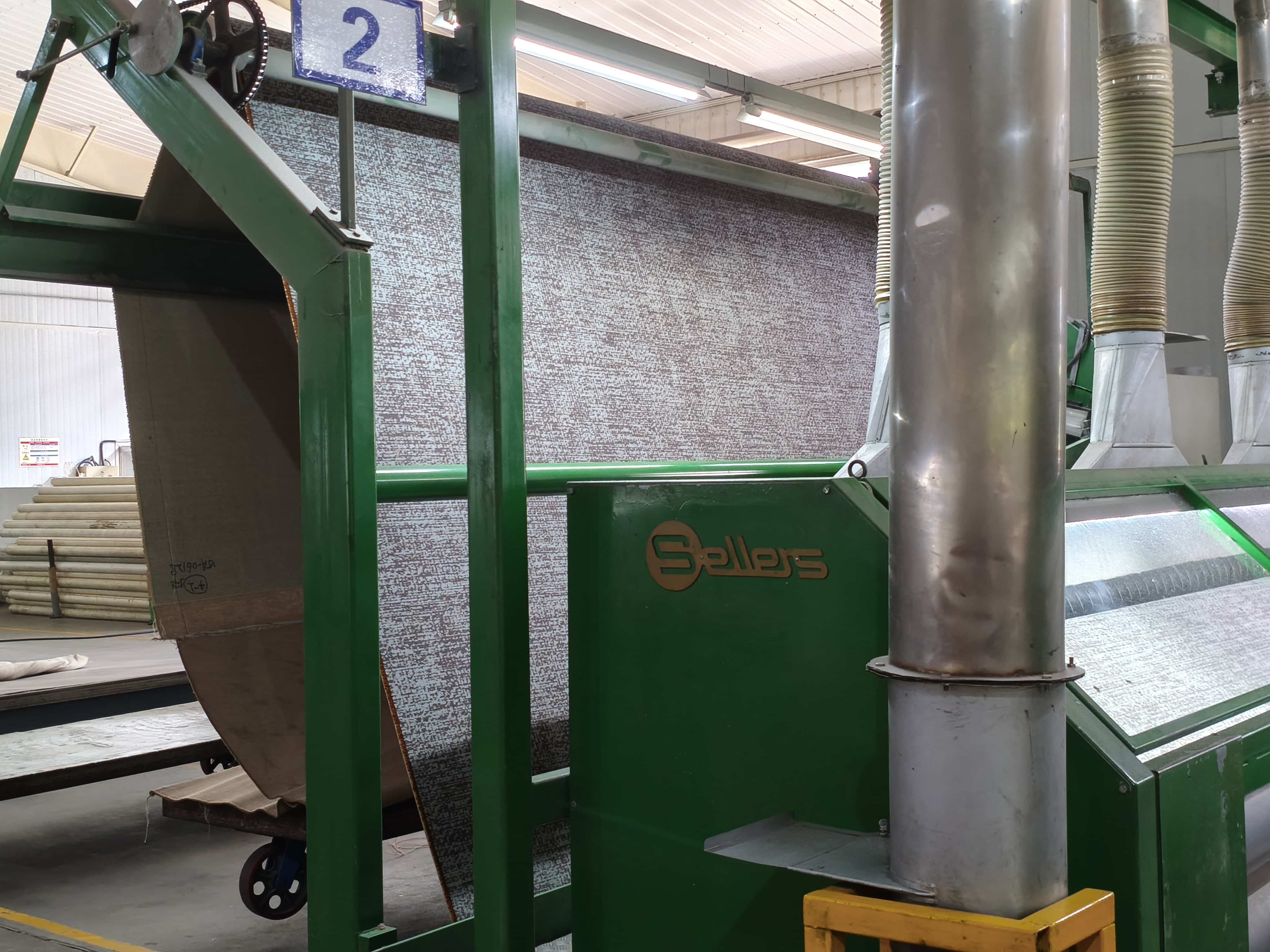 Printed carpet processing line with Sellers-branded machine and large output roll