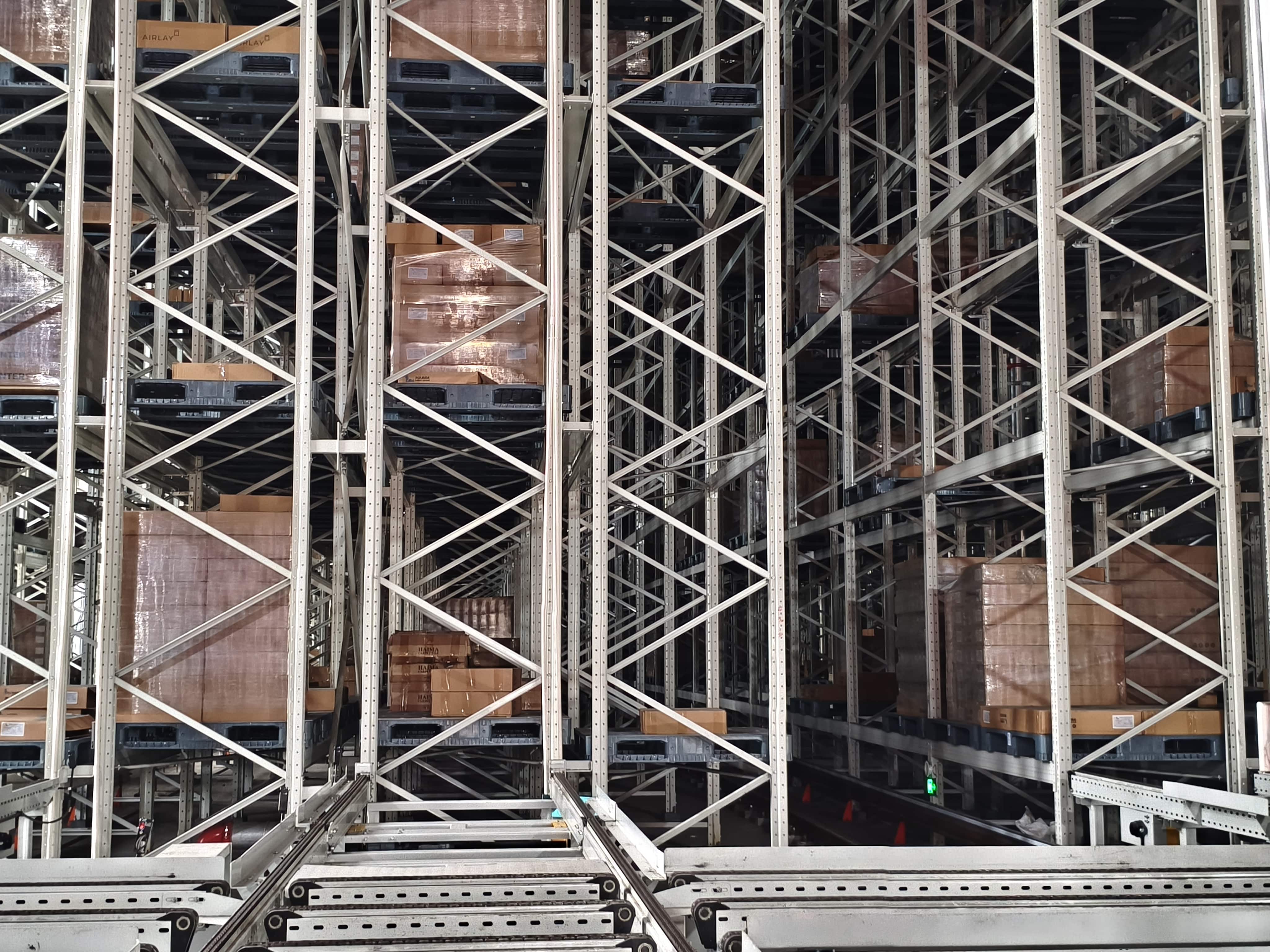 qianqiao automated warehouse with stacked pallets and metal racking system