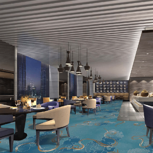 Fine dining restaurant with printed sky blue carpet and gold decorative accents