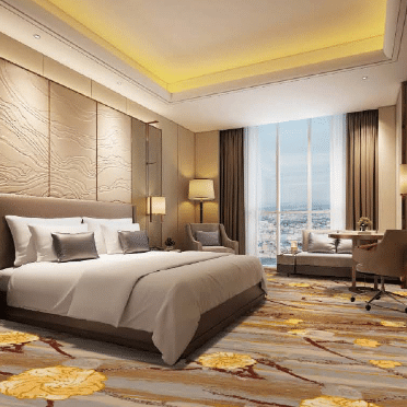 Luxury hotel guest room with printed carpet featuring golden floral patterns on a gray-beige background