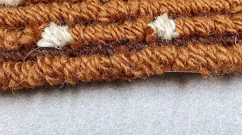 Close-up texture of woven aircraft carpet, durable aviation floor material