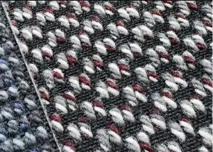 Close-up texture of woven aircraft carpet, durable aviation floor material