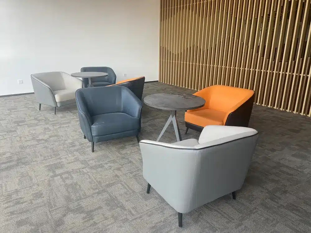 Installation of high-performance carpet tiles in a corporate headquarters by QianQiao manufacturer.