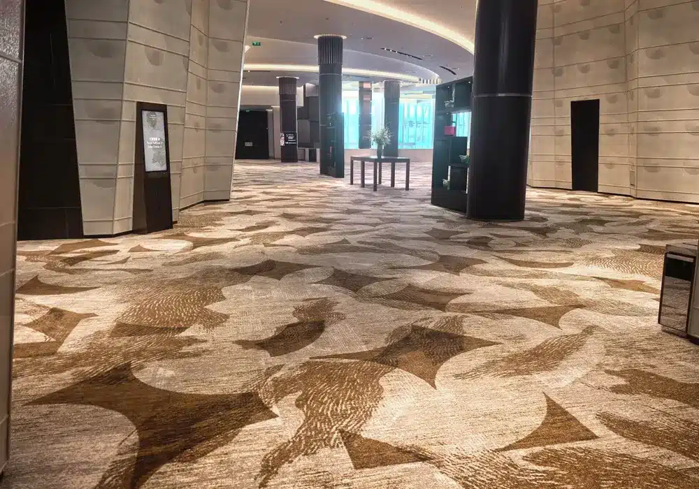 Qianqiao Carpet manufacturing showroom displaying wholesale area rugs and commercial carpets