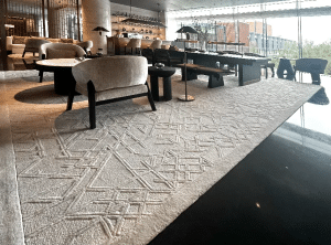 Custom Chinese ink-wash patterned hand-tufted wool carpet by QIANQIAO in the grand lobby of Crowne Plaza Beijing Tongzhou hotel.