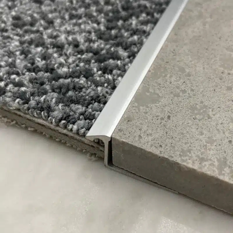 Modern carpet to tile transition design in luxury hotel interior